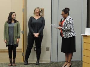 Student Meena Moorthy and teacher Erin Lizer recognized together with Superintendent Dr. Woodson