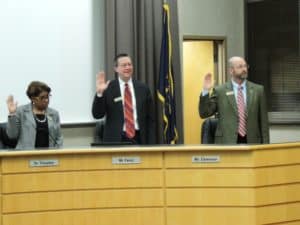 Board Members Dr. Thruston, Mr. Fencl, and Mr. Dzwonar are sworn in.