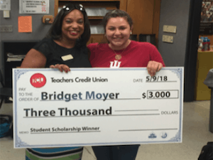 Dr Woodson and Bridget Moyer Dr. Woodson and Bridget Moyer holding $3000 Superintendent Scholarship check.