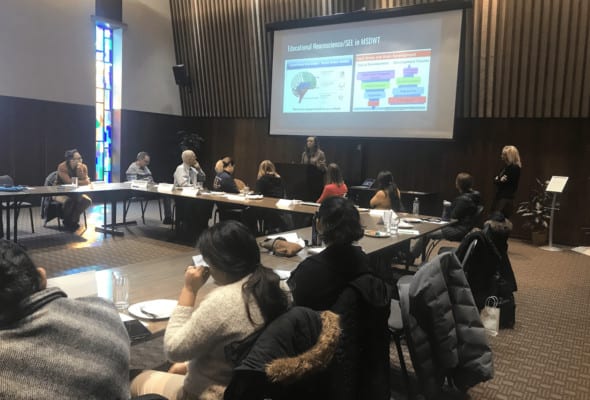 Coalition of Our Immigrant Neighbors attendees viewing a Social Emotional Learning (SEL) presentation