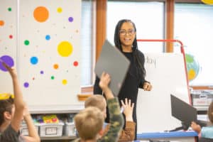 Teacher teaching her students